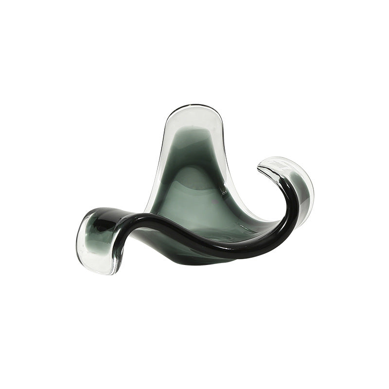 Modern glass sculpture on a white background