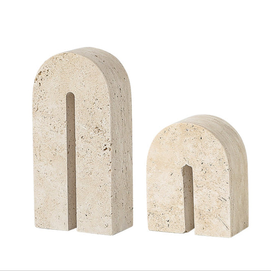 Two beige stone arches on a white background